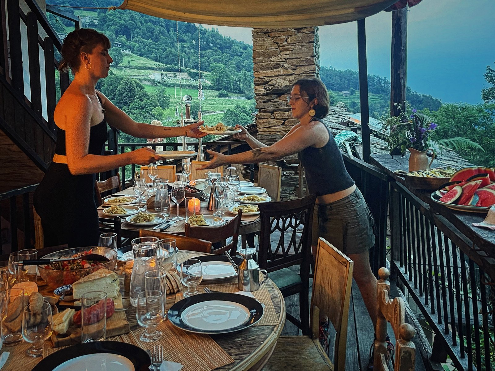 A shared meal being served on the balcony